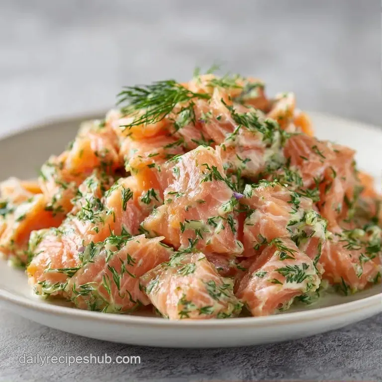 A colorful salad platter featuring tender pink salmon chunks, fresh dill sprigs, and sliced radishes on white porcelain.